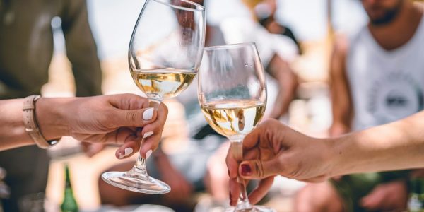 two women holding glass of champagnes