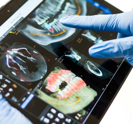 person in blue long sleeve shirt holding black and white tray