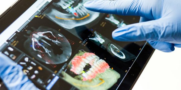 person in blue long sleeve shirt holding black and white tray