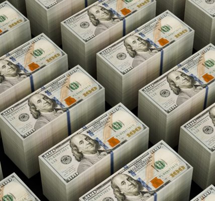 Stacks of hundred dollar bills are shown.