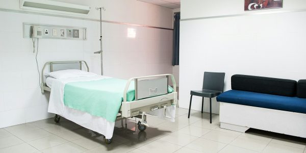 hospital bed near couch